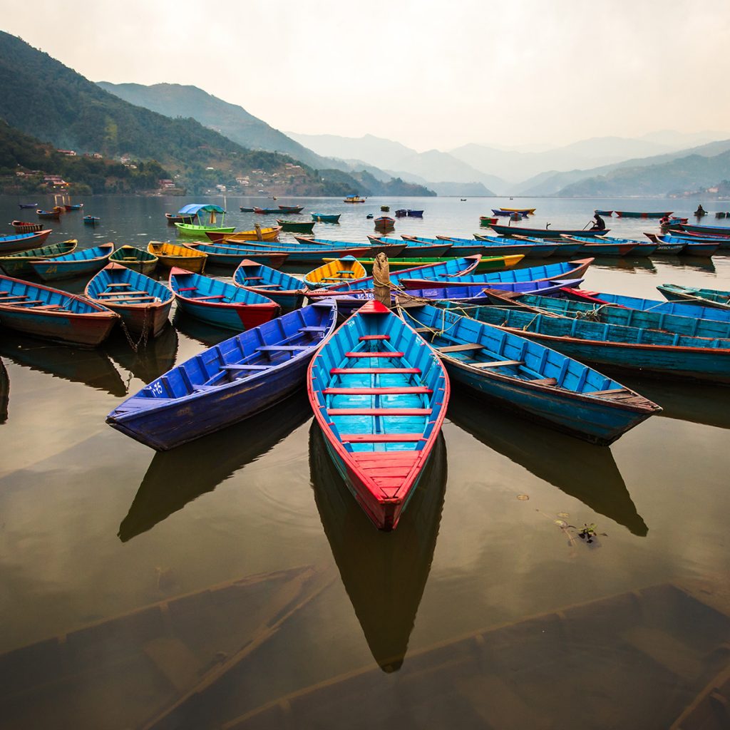 Boats on Phewa Lake at twilight, Pokhara, Nepal