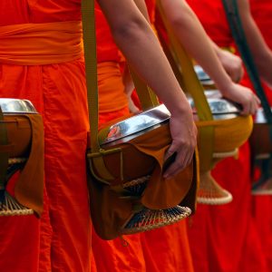 Buddhist monks with alms bowls collecting daily offerings in Luang Prabang, Laos